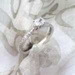 Pretty & Elegant Solitaire set with unusual Oval Cut Diamond centre with Pave set Diamond Shoulders. The Caitlin Diamond Ring is Custom made in 18ct White Gold - Diamond Weight - 0.51 carats.   