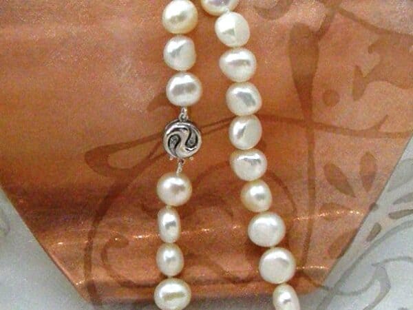 Can anyone help me identify makers mark on this pearl necklace?Thanks for  any info! : r/jewelry