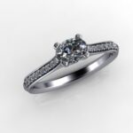 Pretty & Elegant Solitaire set with unusual Oval Cut Diamond centre with Pave set Diamond Shoulders. The Caitlin Diamond Ring is Custom made in 18ct White Gold - Diamond Weight - 0.51 carats.   