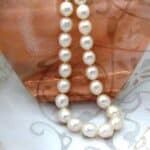 Elegant Oval White Cultured Freshwater Pearl Necklace with rope twist Sterling Silver Clasp.