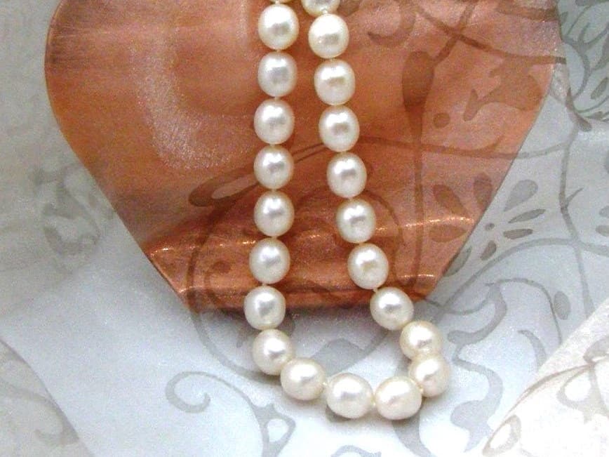 Elegant Oval White Cultured Freshwater Pearl Necklace with rope twist Sterling Silver Clasp.