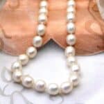 Elegant Oval White Cultured Freshwater Pearl Necklace with rope twist Sterling Silver Clasp.