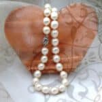 Elegant Oval White Cultured Freshwater Pearl Necklace with rope twist Sterling Silver Clasp.