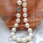 Elegant Oval White Cultured Freshwater Pearl Necklace with rope twist Sterling Silver Clasp.