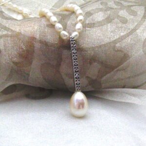 Pretty Allumette Pearl Pendant with Diamonds set with Drop Shape Freshwater pearl ~ designed in 9ct White Gold ~ shown on Rice Shape Freshwater Pearls but available on 9ct white gold chain if you prefer?  Diamond Weight ~ 0.09 carats,   Pendant length ~ 40mm