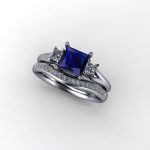Stylish Sapphire Diamond Ring set with square cut sapphire & princess cut diamonds with sweep shoulder detail.  Beth Blue was custom made in 18ct white gold ~ Sapphire Weight - 0.70 carat ~ Diamond Weight- 0.15 carat.   Sapphire is a pretty mid/dark blue with light colour flashes ~ CAD renders show detail of design.     