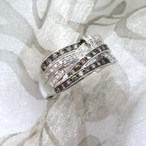 Unusual Diamond Ring set with Chocolate & Brilliant Cut Diamonds in an open weave design as a statement piece. Designed in 9ct White Gold - Diamond Weight -  0.30 carats.     
