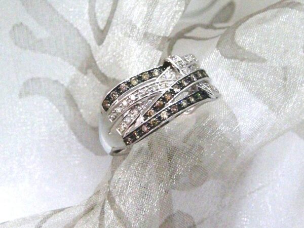 Unusual Diamond Ring set with Chocolate & Brilliant Cut Diamonds in an open weave design as a statement piece. Designed in 9ct White Gold - Diamond Weight -  0.30 carats.     