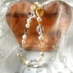 This Baroque Freshwater Pearl Necklace has been enhanced by Baroque Shape Candy Citrine & Rock Crystal in an asymmetrical pattern and finished with a feature bolt ring in Sterling Silver.