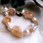 This Baroque Freshwater Pearl Necklace has been enhanced by Baroque Shape Candy Citrine & Rock Crystal in an asymmetrical pattern and finished with a feature bolt ring in Sterling Silver.