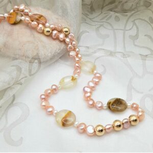 Subtle Pink Freshwater Pearl Necklace enhanced with the warm tones of pebble shape Banded Agate, with gold bead detail by Pearl Perfect.