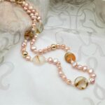 Subtle Pink Freshwater Pearl Necklace enhanced with the warm tones of pebble shape Banded Agate, with gold bead detail by Pearl Perfect.