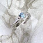Pretty Aquamarine Diamond Ring set with Oval Faceted Aquamarine & Brilliant Cut Diamonds in a Sweep Style Setting. The corners of the Aquamarine setting are also set with feature Accent Diamonds. Custom made in 18ct White Gold – Aquamarine weight 0.23 carats;   Diamond Weight – 0.20 carats.      