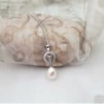 Elegant Vintage Style Pearl Pendant with Pear Shape outline pave set with diamonds and Drop Cultured Freshwater Pearl in 18ct White Gold. Fabienne Pendant measures 27mm in length worn on 18ct White Gold fine rollo chain -  Diamond Weight - 0.10 carat.