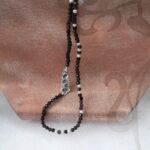 Delicate Freshwater Pearl Necklace with White Freshwater Pearls scattered through Obsidian Beads along the length of the necklace by Pearl Perfect Design Room.