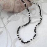 Delicate Freshwater Pearl Necklace with White Freshwater Pearls scattered through Obsidian Beads along the length of the necklace by Pearl Perfect Design Room.
