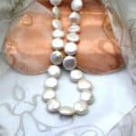 Freshwater Button shape Pearl Necklace fitted with a Sterling Silver feature bolt ring to compliment shape of the pearls