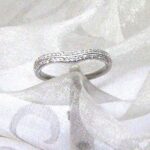 Samara - dainty Curved Diamond Ring set with two rows of Accent Diamonds with raised centre detail.    Wear alone or as a a stacking ring with another design to suit. Designed in 18ct White Gold - Diamond Weight 0.20 carats.    