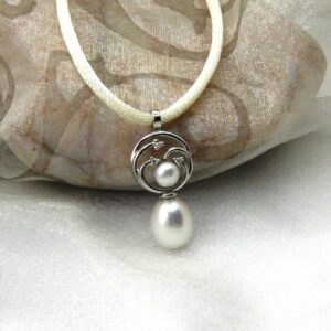Pretty Circles Pearl Pendant set with Drop & Button Snow white Freshwater Pearls & accent diamonds designed in 9ct White Gold. Sonja Silk drop pearl measures 9mm – Pendant length 25mm – shown on cream silk rope but can be supplied on 9ct white gold chain if you prefer?