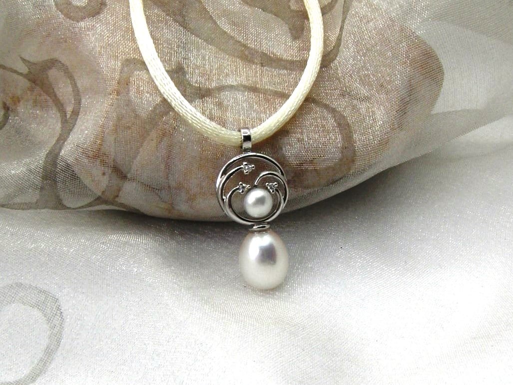 Pretty Circles Pearl Pendant set with Drop & Button Snow white Freshwater Pearls & accent diamonds designed in 9ct White Gold. Sonja Silk drop pearl measures 9mm – Pendant length 25mm – shown on cream silk rope but can be supplied on 9ct white gold chain if you prefer?