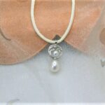 Pretty Circles Pearl Pendant set with Drop & Button Snow white Freshwater Pearls & accent diamonds designed in 9ct White Gold. Sonja Silk drop pearl measures 9mm – Pendant length 25mm – shown on cream silk rope but can be supplied on 9ct white gold chain if you prefer?