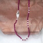 Delicate Freshwater Pearl Necklace designed with faceted rubies and seed freshwater pearls scattered along the length of the necklace by Pearl Perfect Design Room.
