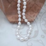 Classic Freshwater Pearl Necklace featuring drop shaped  White Freshwater Pearls fitted with double sided Sterling Silver Gilt clasp by Pearl Perfect Design Room