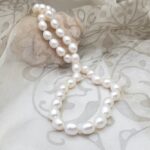Classic Freshwater Pearl Necklace featuring drop shaped  White Freshwater Pearls fitted with double sided Sterling Silver Gilt clasp by Pearl Perfect Design Room