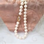 Classic Freshwater Pearl Necklace the white potato shaped Pearls are complemented with a double sided 9ct Yellow & White Gold clasp