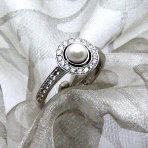 Delightful Pearl Diamond Ring set with Cultured Pearl & pave set diamond halo and shank to half hoop level. The Millegrain Edge detail gives that Vintage look.