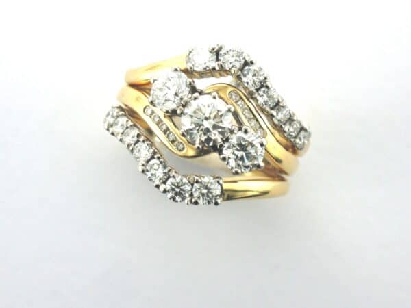 Elaine Bespoke Diamond Rings designed as Partner Rings for this Classic Engagement ring in 18ct gold by Pearl Perfect