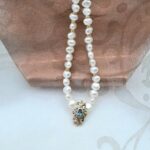 Delicate Freshwater Pearl Necklace with 9ct Yellow Gold Pendant set with Blue Topaz by Pearl Perfect. 