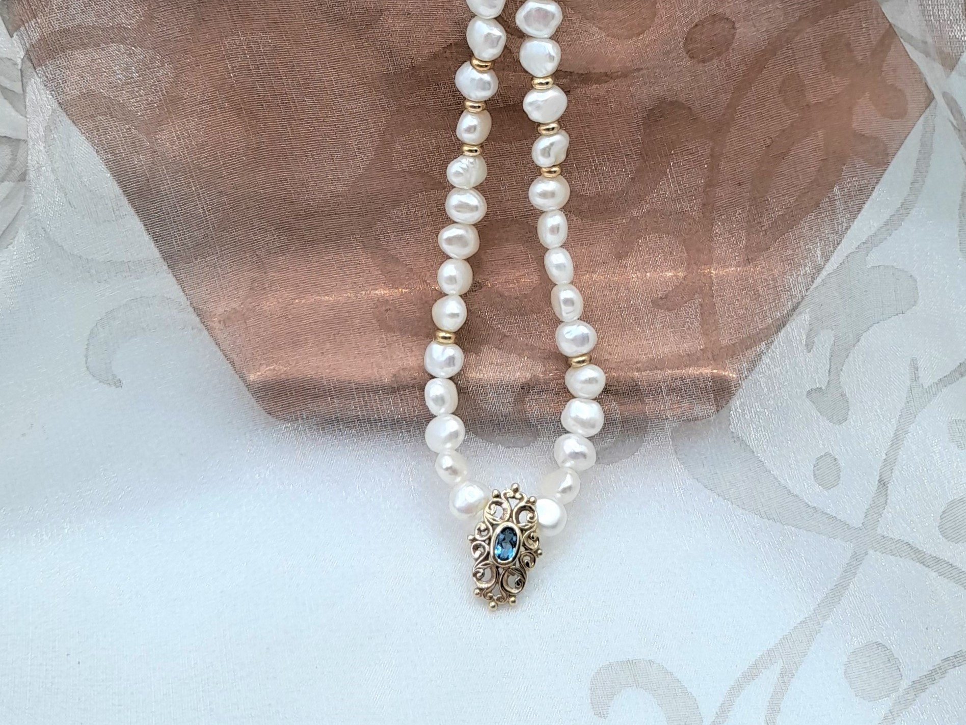 Delicate Freshwater Pearl Necklace with 9ct Yellow Gold Pendant set with Blue Topaz by Pearl Perfect. 
