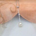 Delicate Alumette shape Pearl Pendant in 9ct white gold bar with pave set Diamonds and Cultured Pearl worn on Venetian box link chain.
