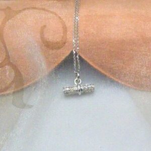 Elegant Toggle Bar Diamond Pendant pave set with rows Brilliant Cut Diamonds in 18ct White Gold worn with fine rollo style chain. Tara measures 14x5mm with classic jump ring fitting;   Diamond Weight 0.18 carats.