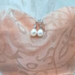 Graceful Freshwater Pearl drop earrings set in 9ct gold with Diamonds