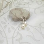 Graceful Freshwater Pearl drop earrings set in 9ct gold with Diamonds