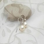 Graceful Freshwater Pearl drop earrings set in 9ct gold with Diamonds