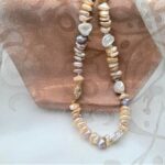 Pretty warm Peach & Plum colours in this Freshwater Pearl Necklace showcase the varied shapes of non-nucleated pearls, typically called Keshi by Pearl Perfect.