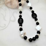Onyx Freshwater Pearl Necklace, the feature Freshwater Pearls are square in shape contrasting with the oval and round highly polished Onyx beads. The necklace is finished with a Sterling Silver Clasp