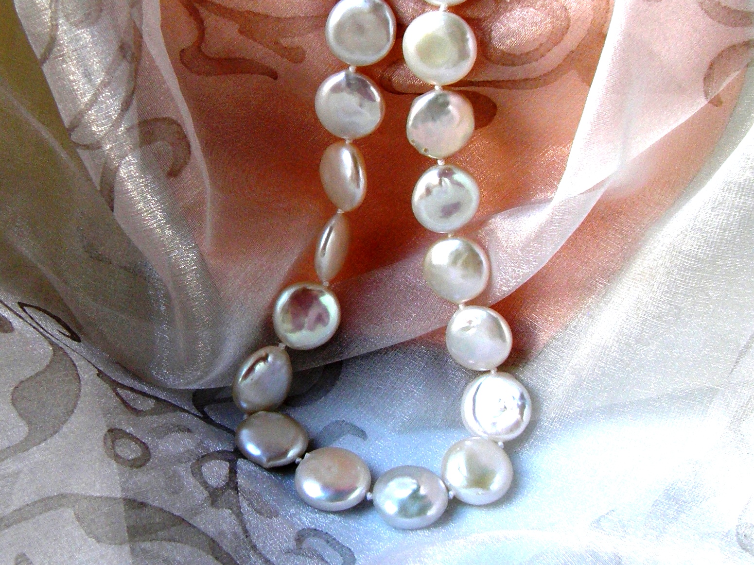 Freshwater Button shape Pearl Necklace fitted with a Sterling Silver feature bolt ring to compliment shape of the pearls.